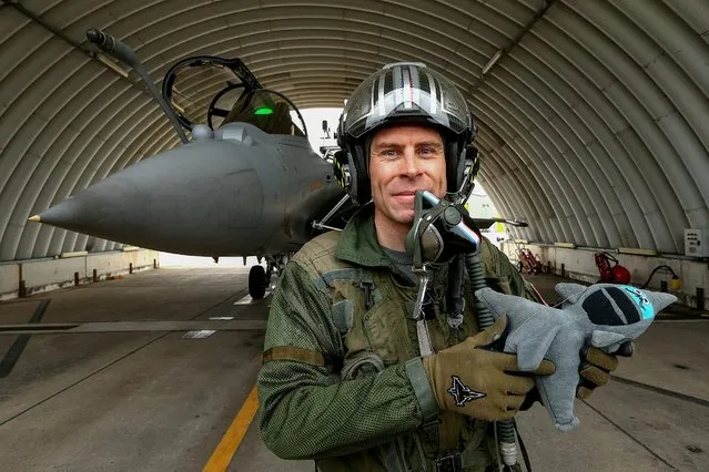 Pilot Jerome Thoule “Schuss” poses after performing a training flight in a Rafale Solo Display (RSD) aircraft during its official presentation at Saint-Dizier air base 113 on March 9, 2021. Dassault Aviation’s Rafale, which is a multirole combat aircraft, began its training flights on February 1, 2021. (Photo by Francois Nascimbeni/AFP Photo)