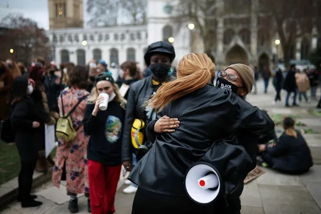 Demonstrators embrace each other as they gather at Parliament Square, following the kidnap and murder of Sarah Everard, in London, Britain, March 16, 2021. (Photo by Henry Nicholls/Reuters)