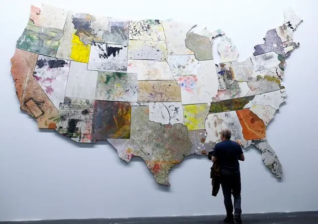 A man looks at the untitled painting from 2013/2015 by artist Nate Lowman at the Art Unlimited exhibition at the Art Basel art fair in Basel, Switzerland on September 21, 2021. (Photo by Arnd Wiegmann/Reuters)
