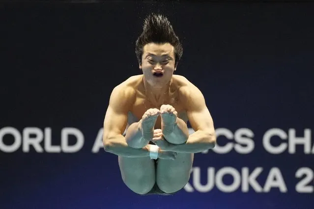 Woo Haram of South Korea competes during the men's 1m springboard diving competition at the World Swimming Championships in Fukuoka, Japan, Sunday, July 16, 2023. (Photo by Lee Jin-man/AP Photo)