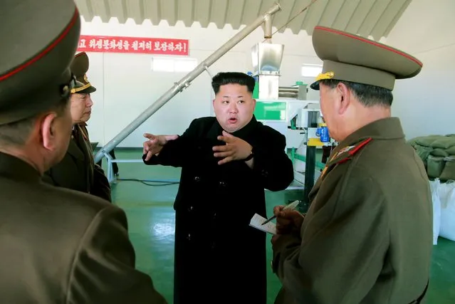 North Korean leader Kim Jong Un gives field guidance at a fish meal fodder factory, newly built by the Korean People's Army (KPA) in this undated photo released by North Korea's Korean Central News Agency (KCNA) in Pyongyang March 24, 2015. (Photo by Reuters/KCNA)