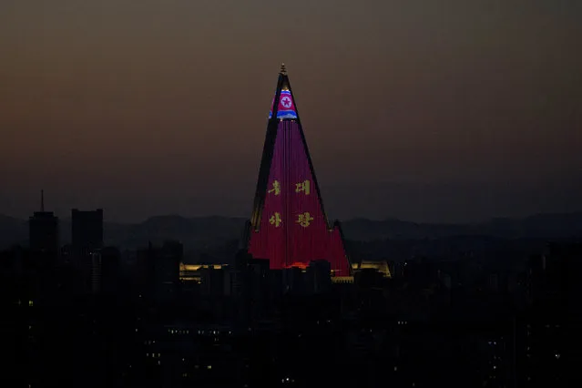 The Ryugyong Hotel is illuminated as the capital prepares for the 70th anniversary of North Korea's founding day in Pyongyang, North Korea, Friday, September 7, 2018. North Korea will be staging a major military parade, huge rallies and reviving its iconic mass games on Sunday to mark its 70th anniversary as a nation. (Photo by Ng Han Guan/AP Photo)