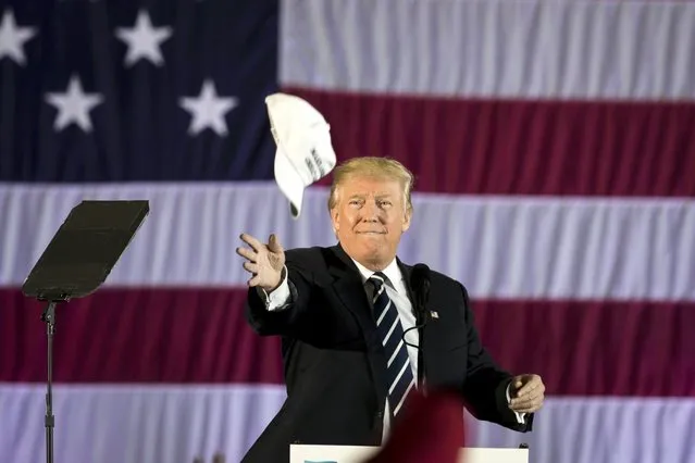 President-elect Donald Trump throws a hat to the crowd while speaking at the Dow Chemical Hangar, December 9, 2016 in Baton Rouge, Louisiana. Trump is in Louisiana to campaign for U.S. Senate candidate John Kennedy. (Photo by Drew Angerer/Getty Images)