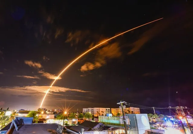 A SpaceX Falcon 9 rocket launch carrying Starlink satellites on its 6-14 Mission from Cape Canaveral Space force Station Launch Complex 40 is seen Friday, Sept. 8, 2023, over the downtown Cocoa Beach, Fla., skyline. (Photo by Malcolm Denemark/Florida Today via AP Photo)