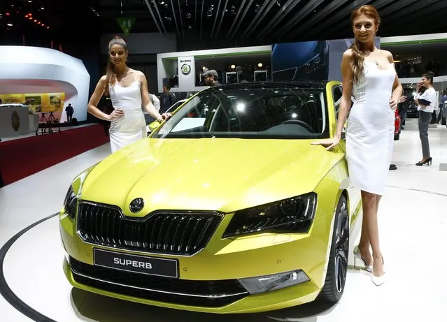 Models pose next to the new Skoda Superb during the second press day ahead of the 85th International Motor Show in Geneva March 4, 2015.  REUTERS/Arnd Wiegmann   