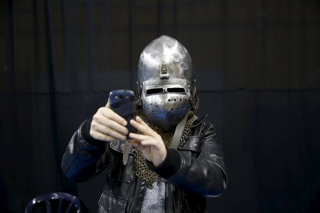 A man takes a selfie with a helmet during an international medieval tournament in Tel Aviv, January 23, 2016. (Photo by Baz Ratner/Reuters)