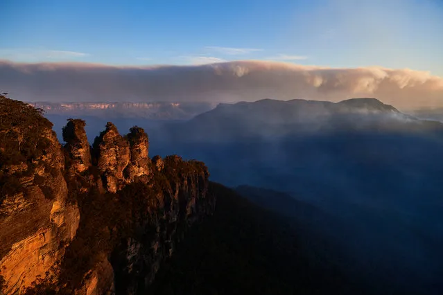 The Three Sisters are pictured as smoke from scattered bushfires covers the horizon on December 04, 2019 in Katoomba, Australia. It is estimated that 20 per cent of the Blue Mountains World Heritage Area has been impacted as bushfires continue across New South Wales. (Photo by Brett Hemmings/Getty Images)