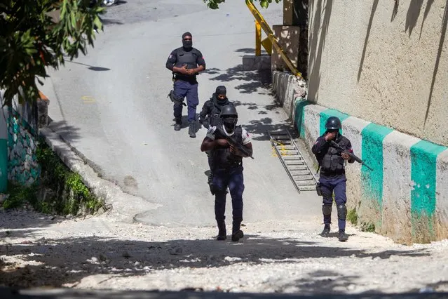 Police agents work near the house of the assassinated Haitian president, Jovenel Moise, in Port-au-Prince, Haiti, 07 July 2021. Four alleged assassins of the Haitian President Jovenel Moise were killed by the police and two others were arrested this Wednesday, announced the Director General of the Police, Leon Charles. President Moise was shot to death in the early morning hours during a raid by armed men on his residence, an attack in which his wife, Martine, was also wounded. (Photo by Jean Marc Herve Abelard/EPA/EFE)