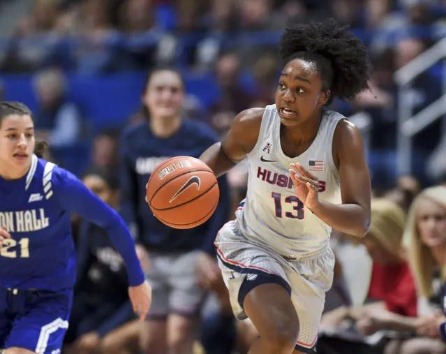 Connecticut's Christyn Williams (13) drives down the court in the first half of an NCAA college basketball game against Seton Hall, Saturday, December 8, 2018, in Hartford, Conn. (Photo by Stephen Dunn/AP Photo)