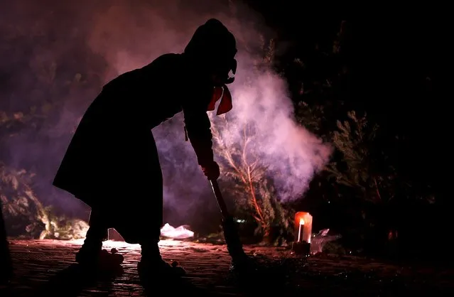 A group of traditional witches (Kandelhexen) dance around a bonfire during their traditional “witches sabbath” carnival performance in the Black Forest village of Waldkirch, Germany, February 6, 2016. (Photo by Kai Pfaffenbach/Reuters)