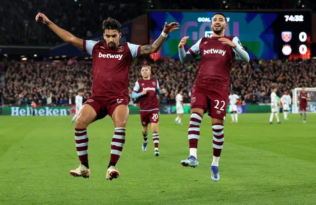 Lucas Paqueta (L) of West Ham celebrates with teammate Said Benrahma after scoring the opening goal during the UEFA Europa League Group A match between West Ham United and Olympiacos Piraeus in London, Britain, 09 November 2023. (Photo by Andy Rain/EPA)