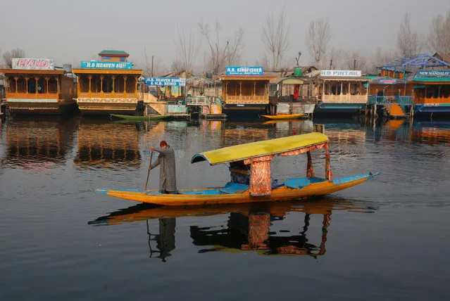 A Kashmiri boatman rows a boat on the waters of Dal Lake in Srinagar, the summer capital of Indian Kashmir, 20 December 2018. President's rule was imposed in Jammu and Kashmir on 19 December midnight after the expiry of six months of Governor's rule in the state. This is the first time since 1996 that the militancy-hit State has come under direct central rule. (Photo by Farooq Khan/EPA/EFE)