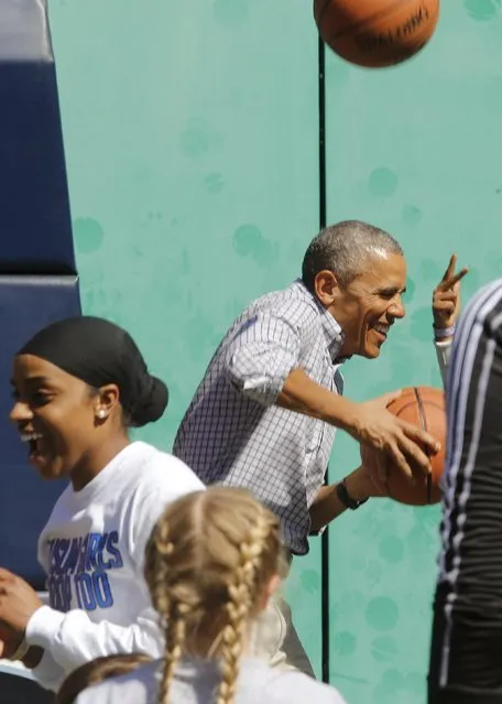 U.S. President Barack Obama reacts to getting hit on the head by a rebound while playing basketball, an exercise activity during the annual Easter Egg Roll at the White House in Washington April 6, 2015. (Photo by Jonathan Ernst/Reuters)