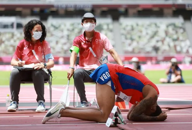 Juan Miguel Echevarria of Cuba reacts after losing the winning position after sustaining an injury at the last moment in the Men's Long Jump on day ten of the Tokyo 2020 Olympic Games at Olympic Stadium on August 2, 2021 in Tokyo, Japan. (Photo by Kai Pfaffenbach/Reuters)