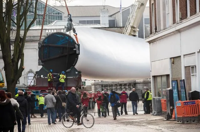A 250ft-long (75m) wind turbine blade, which forms a new sculpture commissioned by multimedia artist Nayan Kulkarni called “Blade” is installed at Queen Victoria Square in Hull on January 8, 2017 in Hull, England. (Photo by PA Wire)