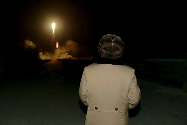 North Korean leader Kim Jong Un watches the ballistic rocket launch drill of the Strategic Force of the Korean People's Army (KPA) at an unknown location, in this undated photo released by North Korea's Korean Central News Agency (KCNA) in Pyongyang on March 11, 2016. (Photo by Reuters/KCNA)