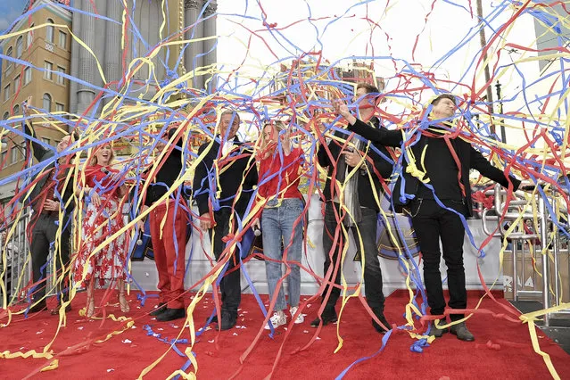 “Avengers: Endgame” cast members, Paul Rudd, from left, Scarlett Johansson, Robert Downey Jr., Robert Iger, Brie Larson, Chris Hemsworth and Jeremy Renner release streamers as they announce the Universe Unites Charity at Disney California Adventure Park on Friday, April 5, 2019, in Anaheim, Calif. (Photo by Richard Shotwell/Invision/AP Photo)