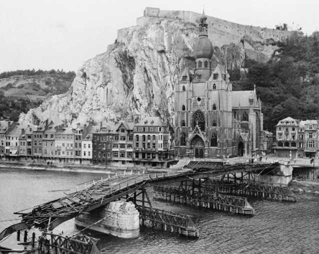 Bridge across the Meuse River at Dinant was destroyed by the fleeing Nazis in an attempt to hold up the onrushing Americans. In the background is the fort of the town, September 16, 1944. Neither the destruction of the bridge nor the guns of the fort, however, could stop the yanks' advance. (Photo by AP Photo)