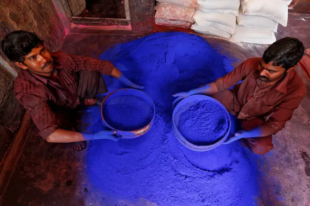 Workers sieve coloured powder before being packed for sale inside a workshop ahead of Holi, the Festival of Colours in Kolkata, India March 3, 2017. (Photo by Rupak De Chowdhuri/Reuters)