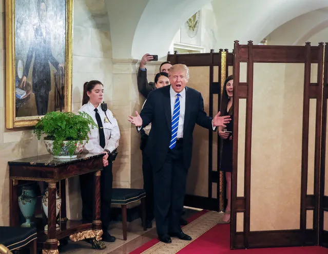 US President Donald J. Trump (C) greets people on a public tour of the White House in Washington, DC, USA, 07 March 2017. It was the first day of White House tours to the public since President Trump was inaugurated. (Photo by Erik S. Lesser/EPA)