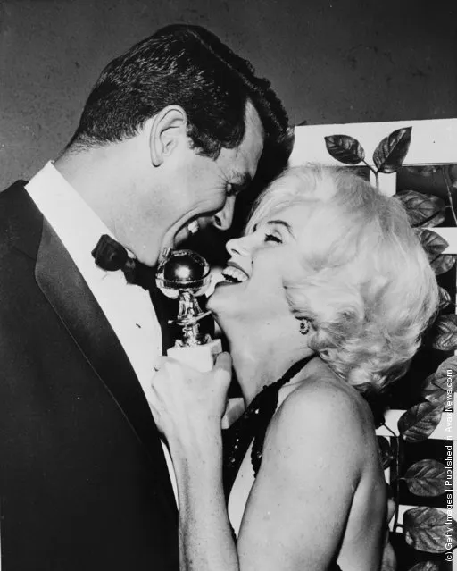 1962: Marilyn Monroe receives her Golden Globe award from Rock Hudson (1925 - 1985) at the Hollywood Foreign Press Association's 19th Annual Dinner