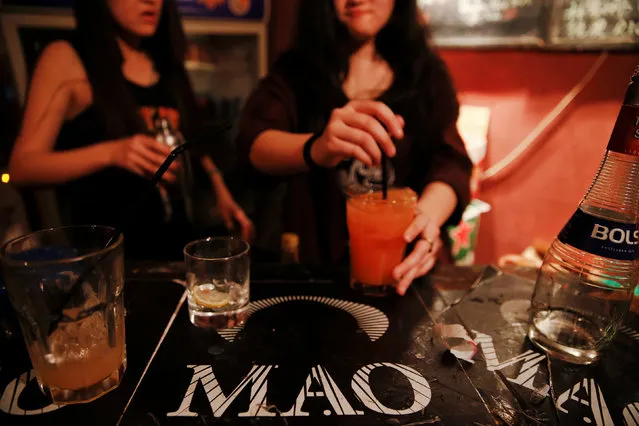 Drinks are made at the bar of Mao Live House during its last public concert night in central Beijing, China April 23, 2016. (Photo by Damir Sagolj/Reuters)