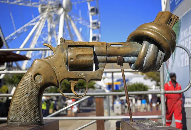 In this Tuesday, February 26, 2013 file photo, a sculpture by Carl Fredrik Reutersward, titled “Knotted gun” which is a symbol designed to protest against global violence and senseless killings, is displayed in Cape Town, South Africa. Carl Fredrik Reutersward, one of Sweden's best-known modern artists and the creator of the iconic statue of a revolver barrel tied in a knot, has died. He was 81. Thomas Millroth, from the Carl Fredrik Reutersward Art Foundation, said the artist died in a hospital in Helsingborg, southwestern Sweden on Tuesday, May 3, 2016. No cause of death was given.(Photo by Schalk van Zuydam/AP Photo)