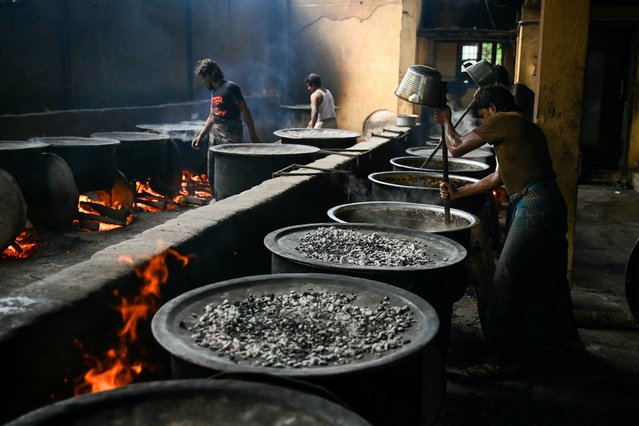 Chefs prepare biryani dish at a mega kitchen facility on Eid al-Adha, in Chennai on June 17, 2024. (Photo by R.Satish Babu/AFP Photo)