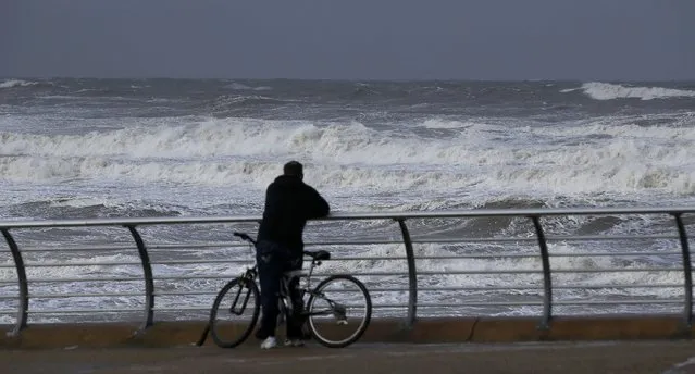 A man looks out at a sea as Storm Doris blows into Blackpool, Britain, February 23, 2017. (Photo by Andrew Yates/Reuters)