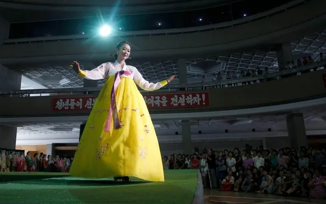 A model displays her dress on the catwalk during the 17th National Exhibition of Korean Dress at the Central Youth Hall in Pyongyang, North Korea, Thursday, September 5, 2019. (Photo by Cha Song Ho/AP Photo)