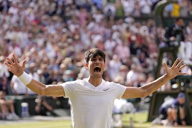 Carlos Alcaraz of Spain celebrates after defeating Novak Djokovic of Serbia in the men's singles final at the Wimbledon tennis championships in London, Sunday, July 14, 2024. (Photo by Alberto Pezzali/AP Photo)