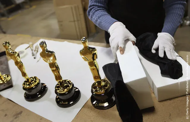 Josefina Govea packages an Oscar statuette at R.S. Owens & Company