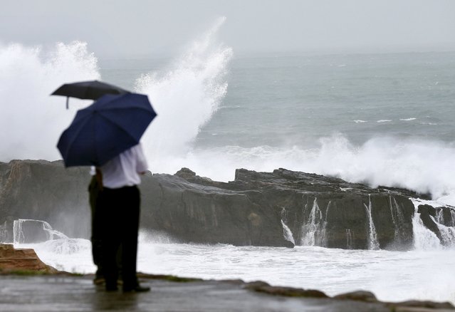 High waves caused by Typhoon Nangka break on the shores of Senjojiki, Shirahama town, Wakayama prefecture, Japan, in this photo taken by Kyodo July 16, 2015. Typhoon Nangka barrelled across the western end of Japan's largest main island on Friday, snarling transport, leaving at least two men dead and prompting authorities to advise nearly 100,000 people to evacuate. (Photo by Reuters/Kyodo News)