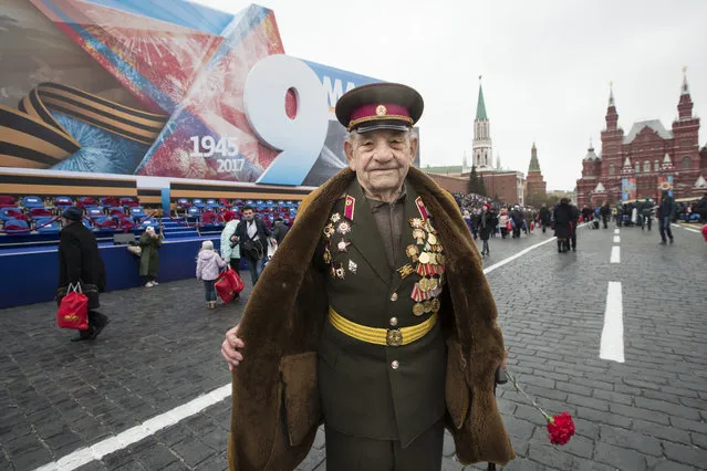 WWII veteran Alexei Marchenkov, 94, poses for a photo at the Red Square during the Victory Day military parade to celebrate 72 years since the end of WWII and the defeat of Nazi Germany, in Moscow, Russia, on Tuesday, May 9, 2017. Marchenkov went to a front on July 12, 1941 in the Soviet Union and finished his service on Sept. 2, 1945 at Far East. (Photo by Alexander Zemlianichenko/AP Photo)