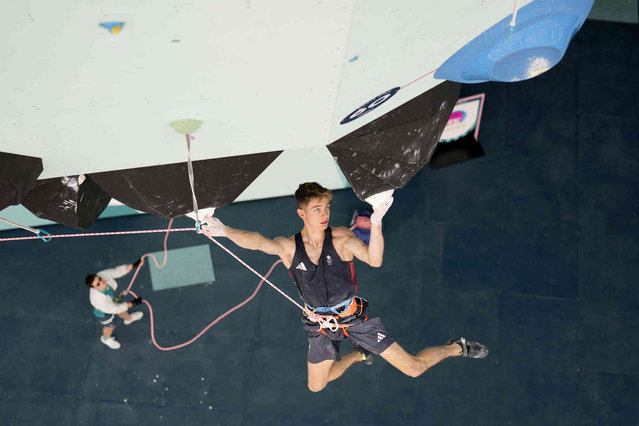 Toby Roberts of Great Britain competes in the men's boulder and lead, lead final, during the sport climbing competition at the 2024 Summer Olympics, Friday, August 9, 2024, in Le Bourget, France. (Photo by Christophe Ena/Pool via AP Photo)