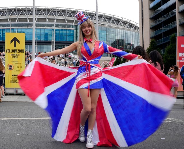 Fans of singer Taylor Swift, called Swifties, arrive at Wembley Stadium in London, Thursday, August 15, 2024 for the first of five concerts of Taylor Swift's Eras Tour.(Photo by Alastair Grant/AP Photo)