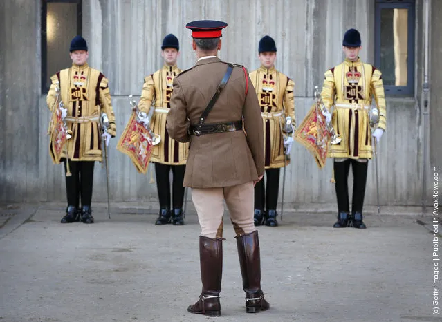 An officer (C) inspects The State Trumpeters of The Household Cavalry Mounted Regiment (HCMR) during parade at Hyde Park Barracks