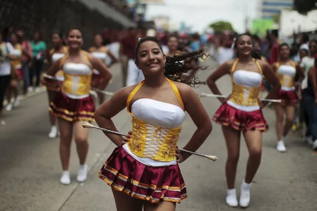 Cheerleaders participate in the opening parade of the festivities of El Divino Salvador del Mundo (The Divine Savior of The World), patron saint of the capital city of San Salvador, El Salvador August 1, 2015. (Photo by Jose Cabezas/Reuters)