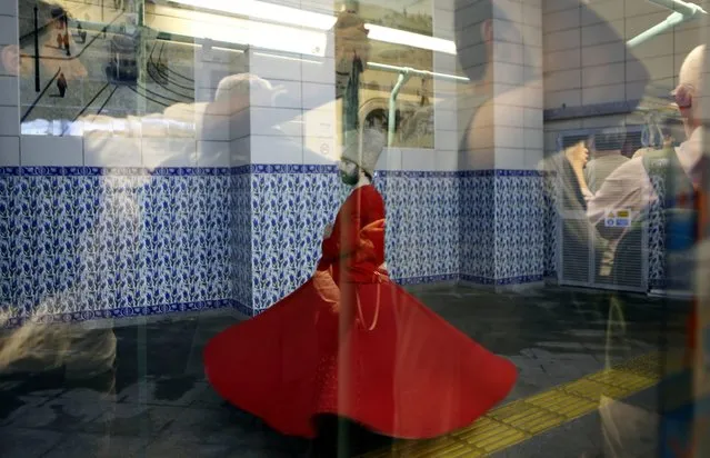 Whirling Sufi Dervish performs part of a Ramadan event as passengers reflected on the window in Beyoglu nostagic subway station second oldest subway in the world, in Istanbul, Turkey, 15 June 2016. Muslims around the world celebrate the holy month of Ramadan by praying during the night time and abstaining from eating and drinking during the period between sunrise and sunset. Ramadan is the ninth month in the Islamic calendar and it is believed that the Koran's first verse was revealed during its last 10 nights. (Photo by Cem Turkel/EPA)