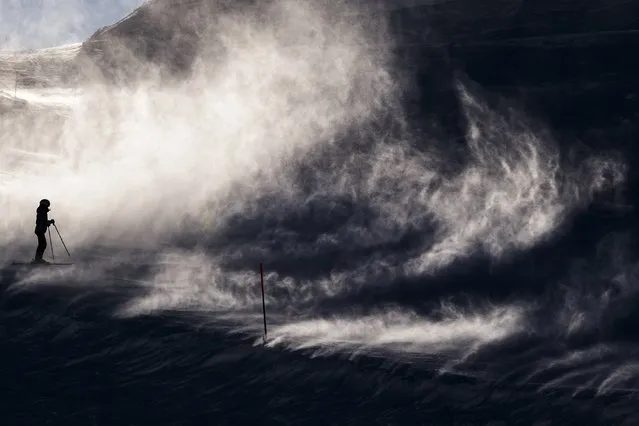 Skiers make their way in strong winds, in Leysin, Switzerland, Sunday, January 19, 2020. (Photo by Jean-Christophe Bott/Keystone via AP Photo)
