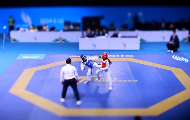 Sahaf Alshammari of Team AlUla (R) competes against Alreem Alduways of Team Al Nassr in the Women's Taekwondo -49kg Preliminaries - Round of 16 Bout on day thirteen of the Saudi Games 2024 on October 15, 2024 in Riyadh, Saudi Arabia. The Saudi Games is a multi-game combined sports tournament and the largest national sporting event held annually in the Kingdom. (Photo by Hector Vivas/Getty Images for Saudi Games)