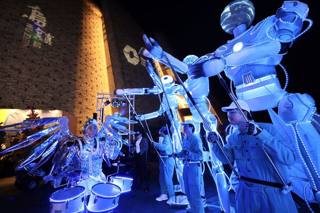 Cast members perform in a parade during the 11th Wuzhen Theater Festival on October 17, 2024 in Jiaxing, Zhejiang Province of China. (Photo by Sun Xiaona, Zhu Aiwen/Zhejiang Daily Press Group/VCG via Getty Images)