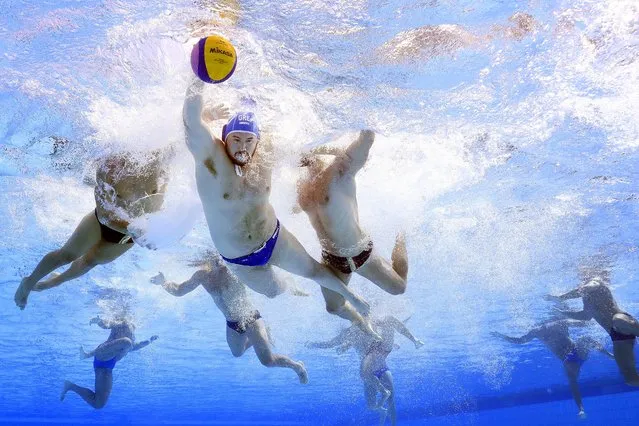 Konstantinos Kakaris #10 of Team Greece battles for the ball against defenders from Team Italy during the Men's Water Polo semifinal match on day 12 of the Budapest 2022 FINA World Championships at Alfred Hajos National Aquatics Complex on July 01, 2022 in Budapest, Hungary. (Photo by Tom Pennington/Getty Images)