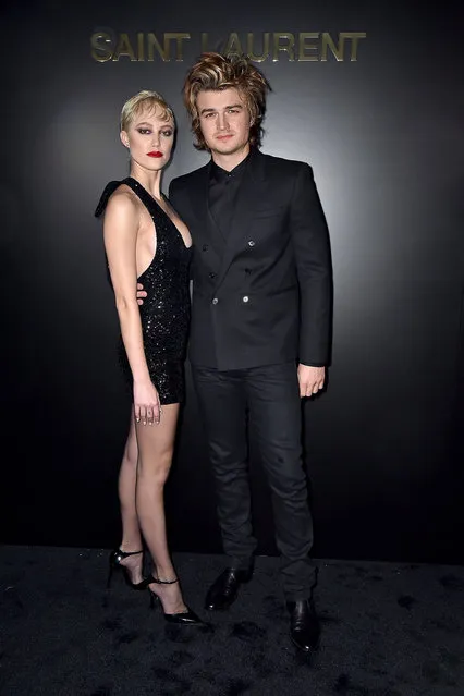 Joe Keery and Maika Monroe attend the Saint Laurent show as part of the Paris Fashion Week Womenswear Fall/Winter 2020/2021 on February 25, 2020 in Paris, France. (Photo by Dominique Charriau/WireImage)