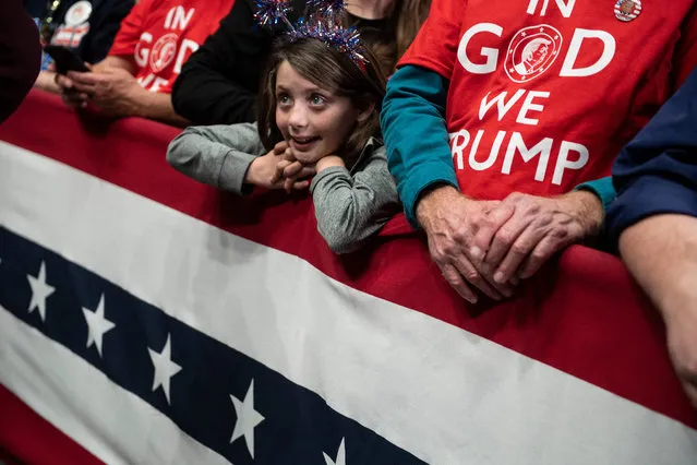 A young supporter reacts as the US president speaks during a rally at Bojangles' Coliseum on March 2, 2020, in Charlotte, North Carolina. (Photo by Brendan Smialowski/AFP Photo)