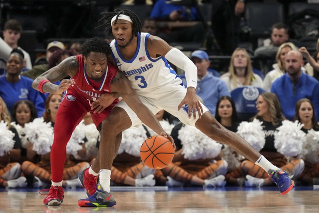 Louisiana Tech guard Amaree Abram, left, takes the ball away from Memphis guard Colby Rogers (3) during the second half of an NCAA college basketball game Wednesday, December 4, 2024, in Memphis, Tenn. Memphis won 81-71. (Photo by George Walker IV/AP Photo)