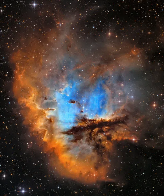 “Stars and Nebulae”. Highly commended: NGC 281 Pacman by Andriy Borovkov (Ukraine) The NGC 281 nebula is known as the “Pacman Nebula” due to its resemblance to the video game character. In the ordinary colours of the visible light spectrum it can look rather dreary, so this image used the Hubble Palette (HST), showcasing the nebula with a vibrant blue surrounded by rusty oranges. Elmshorn, Germany, August/September 2016. UNC 30512 305 mm f/4 reflector telescope, Sky-Watcher EQ8 mount, Moravian Instruments G2-8300 Mono CCD camera, 25-hour total exposure. (Photo by Andriy Borovkov/Insight Astronomy Photographer of the Year 2017)