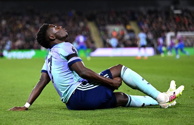 Bukayo Saka of Arsenal reacts after picking up an injury, before receiving medical treatment and leaving the field, during the Premier League match between Crystal Palace FC and Arsenal FC at Selhurst Park on December 21, 2024 in London, England. (Photo by David Price/Arsenal FC via Getty Images)