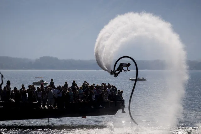 A performance with the Flyboard during an event at the shore of the lake Geneva with over 30 different acrobatic sports in Montreux, Switzerland, Sunday, September 24, 2017. (Photo by Christian Merz/Keystone via AP Photo)