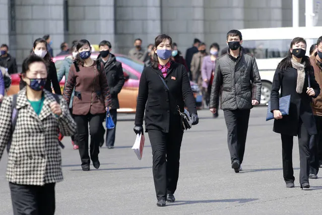 In this April 1, 2020, file photo, pedestrians wear face masks to help prevent the spread of the new coronavirus in Pyongyang, North Korea. North Korea says it has zero coronavirus infections, but experts doubt it and say it’s likely the virus has already spread in the country. (Photo by Cha Song Ho/AP Photo/File)